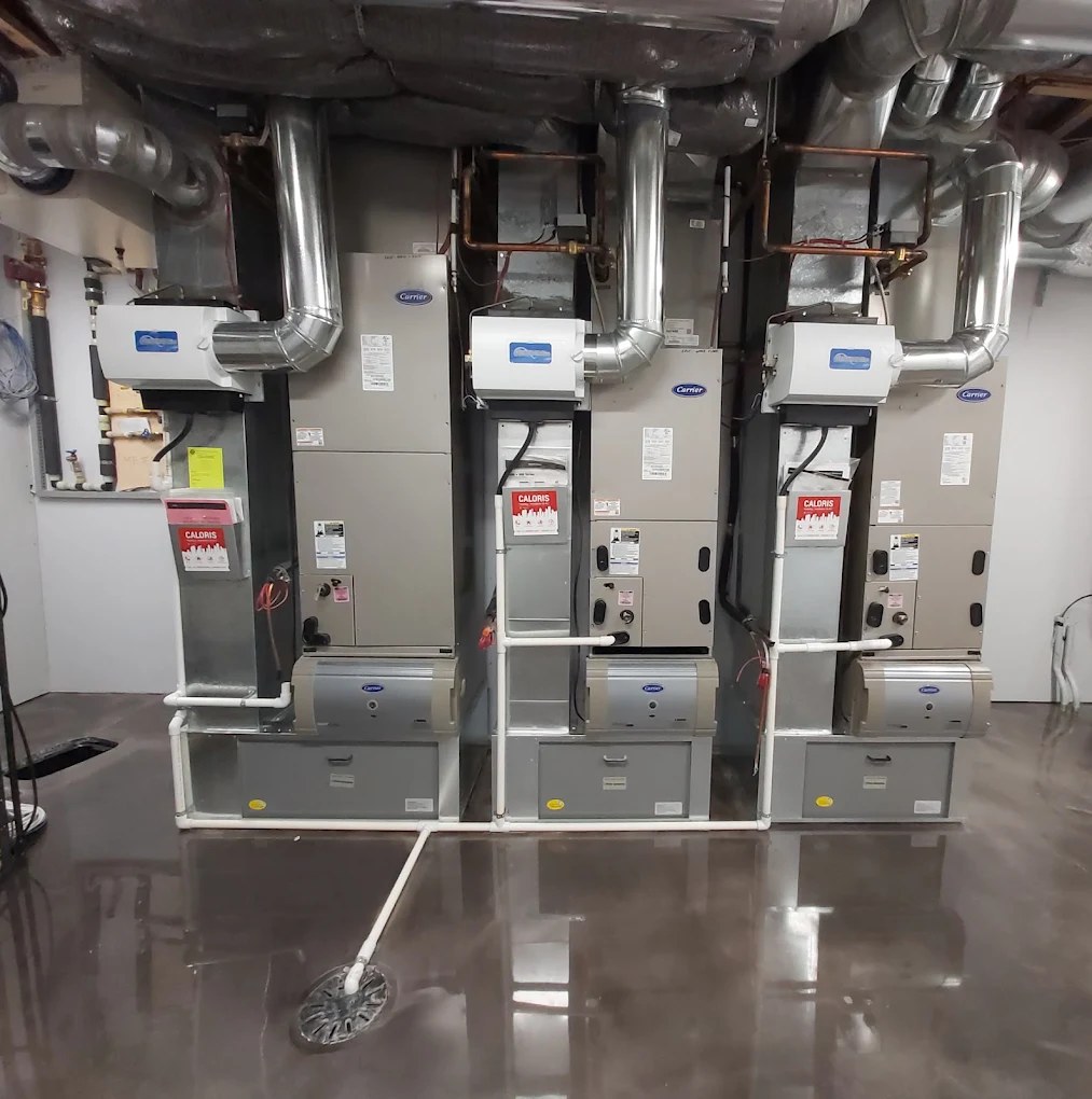 Three Carrier furnaces installed by Caloris in a Calgary mechanical room
