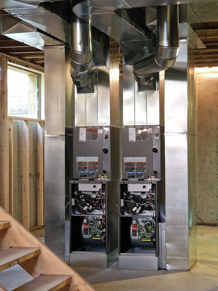Twin furnaces and sheet metal plenums installed by Caloris in a Calgary new build